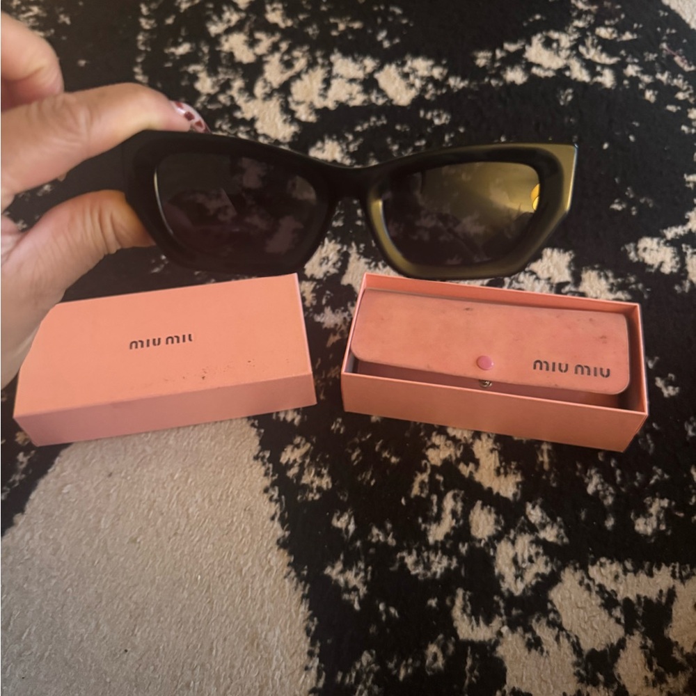 Miu Miu Black and Gold Sunglasses